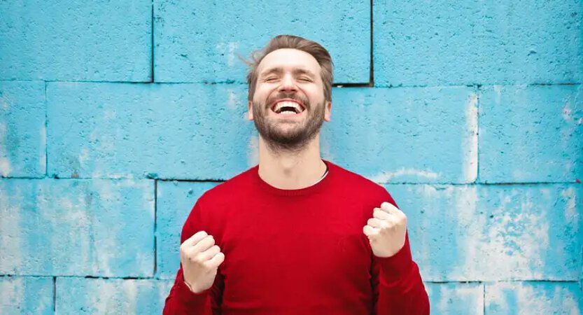 Confident man pumping fists